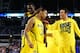 ARLINGTON, TX - MARCH 29: Trey Burke #3 of the Michigan Wolverines celebrates their 87 to 85 win over the Kansas Jayhawks in overtime with teammates during the South Regional Semifinal round of the 2013 NCAA Men's Basketball Tournament at Dallas Cowboys Stadium on March 29, 2013 in Arlington, Texas. (Photo by Tom Pennington/Getty Images)