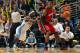 DENVER, CO - JANUARY 13: LeBron James #6 of the Miami Heat controls the ball as Ty Lawson #3 of the Denver Nuggets defends at the Pepsi Center on January 13, 2012 in Denver, Colorado. The Nuggets defeated the Heat 117-104. NOTE TO USER: User expressly acknowledges and agrees that, by downloading and or using this photograph, User is consenting to the terms and conditions of the Getty Images License Agreement. (Photo by Doug Pensinger/Getty Images)