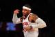 Mar 31, 2013; New York, NY, USA; New York Knicks small forward Carmelo Anthony (7) reacts to a basket against Boston Celtics during the first half at Madison Square Garden. Mandatory Credit: Joe Camporeale-USA TODAY Sports