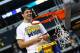 ARLINGTON, TX - MARCH 31: Mitch McGary #4 of the Michigan Wolverines celebrates their 79 to 59 win over the Florida Gators by cutting down a piece of the net during the South Regional Round Final of the 2013 NCAA Men's Basketball Tournament at Dallas Cowboys Stadium on March 31, 2013 in Arlington, Texas. (Photo by Tom Pennington/Getty Images)