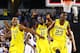 ARLINGTON, TX - MARCH 29: Glenn Robinson III #1, Tim Hardaway Jr. #10 and Caris LeVert #23 of the Michigan Wolverines celebrate their 87 to 85 win over the Kansas Jayhawks in overtime during the South Regional Semifinal round of the 2013 NCAA Men's Basketball Tournament at Dallas Cowboys Stadium on March 29, 2013 in Arlington, Texas. (Photo by Tom Pennington/Getty Images)