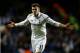 LONDON, ENGLAND - FEBRUARY 14: Gareth Bale of Spurs celebrates after scoring his team's match winning second goal from a free kick during the UEFA Europa League round of 32 first leg match between Tottenham Hotspur and Olympique Lyonnais at White Hart Lane on February 14, 2013 in London, England. (Photo by Paul Gilham/Getty Images)