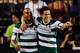 LAS VEGAS, NV - AUGUST 05: Christian Suarez, #13 of Club Santos Laguna celebrates with teammate Herculez Gomez, #16 after scoring a goal against Real Madrid CF during the first half at the World Football Challenge match at Sam Boyd Stadium on August 5, 2012 in Las Vegas, Nevada. (Photo by David Becker/Getty Images)