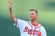 Apr 1, 2013; Atlanta, GA, USA; Atlanta Braves former player Chipper Jones waves to the fans before throwing out the ceremonial first pitch on opening day against the Philadelphia Phillies at Turner Field. The Braves defeated the Phillies 7-5. Mandatory Credit: Dale Zanine-USA TODAY Sports