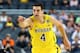 ARLINGTON, TX - MARCH 31: Mitch McGary #4 of the Michigan Wolverines reacts in the first half against the Florida Gators during the South Regional Round Final of the 2013 NCAA Men's Basketball Tournament at Dallas Cowboys Stadium on March 31, 2013 in Arlington, Texas. (Photo by Tom Pennington/Getty Images)