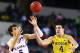 ARLINGTON, TX - MARCH 29: Mitch McGary #4 of the Michigan Wolverines and Jeff Withey #5 of the Kansas Jayhawks vie for posession during the South Regional Semifinal round of the 2013 NCAA Men's Basketball Tournament at Dallas Cowboys Stadium on March 29, 2013 in Arlington, Texas. (Photo by Tom Pennington/Getty Images)