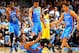 DENVER, CO - JANUARY 20: Russell Westbrook #0 of the Oklahoma City Thunder is helped to his feet by teammates Kevin Durant #35, Thabo Sefolosha #2 and Kevin Martin #23 of the Oklahoma City Thunder against the Denver Nuggets at the Pepsi Center on January 20, 2013 in Denver, Colorado. The Nuggets defeated the Thunder 121-118 in overtime. NOTE TO USER: User expressly acknowledges and agrees that, by downloading and or using this photograph, User is consenting to the terms and conditions of the Getty Images License Agreement. (Photo by Doug Pensinger/Getty Images)
