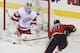 CALGARY, CANADA - MARCH 13: Jay Bouwmeester #4 of the Calgary Flames scores against Jonas Gustavsson #50 of the Detroit Red Wings in first period NHL action on March 13, 2013 at the Scotiabank Saddledome in Calgary, Alberta, Canada. (Photo by Mike Ridewood/Getty Images)