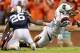 AUBURN, AL - SEPTEMBER 25: Mike McNeil #26 of the Auburn Tigers defends as Demond Washington #14 sacks quarterback Stephen Garcia #5 of the South Carolina Gamecocks at Jordan-Hare Stadium on September 25, 2010 in Auburn, Alabama. (Photo by Kevin C. Cox/Getty Images)