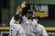 MILWAUKEE, WI - APRIL 2: Dexter Fowler #24 of the Colorado Rockies celebrates with Carlos Gonzalez #5 and Michael Cuddyer #3 after the win over the Milwaukee Brewers 8-4 at Miller Park on April 2, 2013 in Milwaukee, Wisconsin. (Photo by Mike McGinnis/Getty Images)