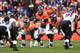DENVER, CO - JANUARY 12: Peyton Manning #18 of the Denver Broncos calls signals out in the shotgun formation behind the line of scrimmage against the Baltimore Ravens during the AFC Divisional Playoff Game at Sports Authority Field at Mile High on January 12, 2013 in Denver, Colorado. The Ravens won 38-35 in 2 overtimes. (Photo by Doug Pensinger/Getty Images)