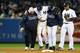 NEW YORK, NY - OCTOBER 13: Derek Jeter #2 of the New York Yankees is carried off of the field by trainer Steve Donohue (L) and manager Joe Girardi after Jeter injured his leg in the top of the 12th inning against the Detroit Tigers during Game One of the American League Championship Series at Yankee Stadium on October 13, 2012 in the Bronx borough of New York City, New York. (Photo by Al Bello/Getty Images)