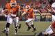STILLWATER, OK - NOVEMBER 17: Quarterback J.W. Walsh #4 of the Oklahoma State Cowboys looks for a hole against the Texas Tech Red Raiders November 17, 2012 at Boone Pickens Stadium in Stillwater, Oklahoma. Oklahoma State defeated Texas Tech 59-21. (Photo by Brett Deering/Getty Images)