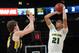 Apr 4, 2013; New York, NY, USA; Baylor Bears center Isaiah Austin (21) puts up a shot over Iowa Hawkeyes center Adam Woodbury (34) during the first half of the championship game of the 2013 NIT basketball tournament at Madison Square Garden. Mandatory Credit: Joe Camporeale-USA TODAY Sports