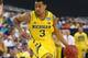 Mar 31, 2013; Arlington, TX, USA; Michigan Wolverines guard Trey Burke (3) drives against the Florida Gators in the first half during the South regional final of the 2013 NCAA Tournament at Cowboys Stadium. Mandatory Credit: Matthew Emmons-USA TODAY Sports