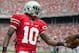 Sept 1, 2012; Columbus, OH, USA; Ohio State Buckeyes wide receiver Corey Brown (10) hands the ball to an official after scoring a touchdown during the second quarter of the game against the Miami Redhawks at Ohio Stadium. Mandatory Credit: Rob Leifheit-USA TODAY Sports