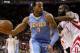 Jan 23, 2013; Houston, TX, USA; Denver Nuggets shooting guard Andre Iguodala (9) controls the ball during the fourth quarter as Houston Rockets shooting guard James Harden (13) defends at Toyota Center. Mandatory Credit: Troy Taormina-USA TODAY Sports