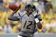 MORGANTOWN, WV - SEPTEMBER 22: Geno Smith #12 of the West Virginia Mountaineers drops back to pass against the Maryland Terrapins during the game on September 22, 2012 at Mountaineer Field in Morgantown, West Virginia. WVU defeated Maryland 31-21. (Photo by Justin K. Aller/Getty Images)