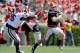 Aaron Murray escapes pressure during the Georgia spring game.