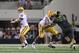 Sep 3, 2011; Arlington, TX, USA; LSU Tigers quarterback Jarrett Lee (12) throws in the pocket with protection by tackle Chris Faulk (76)against the Oregon Ducks at Cowboys Stadium. Mandatory Credit: Matthew Emmons-USA TODAY Sports