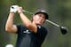 HUMBLE, TX - MARCH 31: Phil Mickelson watches his tee shot on the seventh hole during the final round of the Shell Houston Open at the Redstone Golf Club on March 31, 2013 in Humble, Texas. (Photo by Scott Halleran/Getty Images)