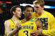 ARLINGTON, TX - MARCH 29: Trey Burke #3 of the Michigan Wolverines reacts after shooting a game tying three pointer with teammates in the final seconds of the second half againist the Kansas Jayhawks during the South Regional Semifinal round of the 2013 NCAA Men's Basketball Tournament at Dallas Cowboys Stadium on March 29, 2013 in Arlington, Texas. (Photo by Tom Pennington/Getty Images)