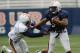 Ricardo Louis escapes a tackler in spring practice on April 3. Photo credit: Todd Van Emst / Auburn media relations