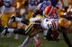 BATON ROUGE, LA - OCTOBER 08: Deangelo Peterson #19 of the Louisiana State University Tigers is tackled by Matt Elam #22 of the Florida Gators at Tiger Stadium on October 8, 2011 in Baton Rouge, Louisiana. (Photo by Chris Graythen/Getty Images)