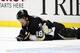 PITTSBURGH, PA - APRIL 05: James Neal #18 of the Pittsburgh Penguins lies injured on the ice after taking an elbow to the head against the New York Rangers during the game at Consol Energy Center on April 5, 2013 in Pittsburgh, Pennsylvania. The Penguins defeated the Rangers 2-1 in a shootout. (Photo by Justin K. Aller/Getty Images)