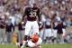 Nov 17, 2012; College Station, TX, USA; Texas A&M Aggies running back Christine Michael (33) taunts Sam Houston State Bearkats defensive back Kenneth Jenkins (32) during the first half at Kyle Field. Michael would be ejected on the play. Mandatory Credit: Thomas Campbell-USA TODAY Sports
