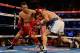 HOUSTON, TX - DECEMBER 15: Nonito Donaire of the Philippines (L) hits Jorge Arce of Mexico during their WBO World Super Bantamweight bout at the Toyota Center on December 15, 2012 in Houston, Texas. (Photo by Scott Halleran/Getty Images)