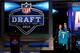 NEW YORK, NY - APRIL 26: Ryan Tannehill from Texas A&M holds up a jersey as he stands on stage with NFL Commissioner Roger Goodell after he was selected #8 overall by the Miami Dolphins in the first round of during the 2012 NFL Draft at Radio City Music Hall on April 26, 2012 in New York City. (Photo by Chris Chambers/Getty Images)