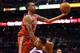 PHOENIX, AZ - JANUARY 17: John Henson #31 of the Milwaukee Bucks attempts a shot over Markieff Morris #11 of the Phoenix Suns during the NBA game at US Airways Center on January 17, 2013 in Phoenix, Arizona. NOTE TO USER: User expressly acknowledges and agrees that, by downloading and or using this photograph, User is consenting to the terms and conditions of the Getty Images License Agreement. (Photo by Christian Petersen/Getty Images)