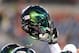 Sept. 29, 2012; Seattle, WA, USA; A Oregon Ducks player holds up his helmet before a game against the Washington State Cougars at CenturyLink Field. Mandatory Credit: James Snook-USA TODAY Sports