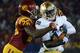 LOS ANGELES, CA - NOVEMBER 24: Cierre Wood #20 of the Notre Dame Fighting Irish protects the ball as he is tackled by Josh Shaw #26 of the USC Trojans during a 22-13 Notre Dame win at Los Angeles Memorial Coliseum on November 24, 2012 in Los Angeles, California. (Photo by Harry How/Getty Images)