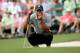 AUGUSTA, GA - APRIL 11: Tiger Woods of the United States lines up a putt on the 17th green during the first round of the 2013 Masters Tournament at Augusta National Golf Club on April 11, 2013 in Augusta, Georgia. (Photo by Harry How/Getty Images)