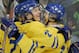 THIEF RIVER FALLS, MN - DECEMBER 30: Forwards Linus Videll #18 and Carl Soderberg #27 of Sweden celebrate Videll's goal against Slovakia during the second period of their preliminary game of the World Junior Hockey Championship tournament at the Ralph Engelstad Arena on December 30, 2004 in Thief River Falls, Minnesota. (Photo by Jeff Vinnick/Getty Images)