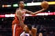 PHOENIX, AZ - JANUARY 17: John Henson #31 of the Milwaukee Bucks attempts a shot over Markieff Morris #11 of the Phoenix Suns during the NBA game at US Airways Center on January 17, 2013 in Phoenix, Arizona. NOTE TO USER: User expressly acknowledges and agrees that, by downloading and or using this photograph, User is consenting to the terms and conditions of the Getty Images License Agreement. (Photo by Christian Petersen/Getty Images)