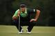 AUGUSTA, GA - APRIL 11: Dustin Johnson of the United States lines up a putt on the 18th hole during the first round of the 2013 Masters Tournament at Augusta National Golf Club on April 11, 2013 in Augusta, Georgia. (Photo by Mike Ehrmann/Getty Images)