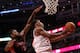 CHICAGO, IL - APRIL 09: Jimmy Butler #21 of the Chicago Bulls puts up a shot in front of Amir Johnson #15 of the Toronto Raptors on his way to a game-high 28 points at the United Center on April 9, 2013 in Chicago, Illinois. The Raptors defeated the Bulls 101-98. NOTE TO USER: User expressly acknowledges and agrees that, by downloading and or using this photograph, User is consenting to the terms and conditions of the Getty Images License Agreement. (Photo by Jonathan Daniel/Getty Images)