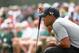 AUGUSTA, GA - APRIL 11: Tiger Woods of the United States lines up a putt on the 18th hole during the first round of the 2013 Masters Tournament at Augusta National Golf Club on April 11, 2013 in Augusta, Georgia. (Photo by Mike Ehrmann/Getty Images)