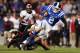 CHARLOTTE, NC - DECEMBER 27: Drew Frey #26 of the Cincinnati Bearcats dives to tackle Conner Vernon #2 of the Duke Blue Devils during their game at Bank of America Stadium on December 27, 2012 in Charlotte, North Carolina. (Photo by Streeter Lecka/Getty Images)