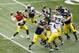 Apr 13, 2013; Ann Arbor, MI, USA; Michigan Wolverines quarterback Devin Gardner (left) drops back to pass during the Spring Game at Michigan Stadium. Mandatory Credit: Rick Osentoski-USA TODAY Sports