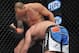 April 13, 2013; Las Vegas, NV, USA; Travis Browne elbows Gabriel Gonzaga to knock him out during the TUF 17 Finale at the Mandalay Bay Events Center. Mandatory Credit: Gary A. Vasquez-USA TODAY Sports
