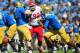 October 13, 2012; Pasadena, CA, USA; Utah Utes defensive tackle Star Lotulelei (92) breaks through the defense of UCLA Bruins center Jake Brendel (54) during the first half at the Rose Bowl. Mandatory Credit: Gary A. Vasquez-USA TODAY Sports