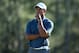 AUGUSTA, GA - APRIL 13: Tiger Woods of the United States stands on the 18th hole during the third round of the 2013 Masters Tournament at Augusta National Golf Club on April 13, 2013 in Augusta, Georgia. (Photo by Andrew Redington/Getty Images)