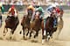 HOT SPRINGS, AR - APRIL 14: Horses round the first turn during Race #3 at Oaklawn Park during the Racing Festival of The South on April 14, 2012 in Hot Springs, Arkansas. (Photo by Wesley Hitt/Getty Images)