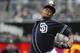 SAN DIEGO, CA - APRIL 13: Edinson Volquez #37 of the San Diego Padres pitches during the first inning of a baseball game against the Colorado Rockies at Petco Park on April 13, 2013 in San Diego, California. (Photo by Denis Poroy/Getty Images)