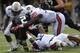 Auburn defenders Demetruce McNeal, Cassanova McKinzy and Jonathan Mincy tackle Vandy's Zac Stacy and force a turnover. Photo credit: Todd Van Emst / Auburn media relations
