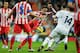 MADRID, SPAIN - DECEMBER 1: Juanfran Torres Belen of Club Atletico de Madrid competes for the ball with Karim Benzema of Real Madrid CF and his teammate Xabi Alonso during the La Liga match between Real Madrid CF and Club Atletico de Madrid at Estadio Santiago Bernabeu on December 1, 2012 in Madrid, Spain. (Photo by Gonzalo Arroyo Moreno/Getty Images)